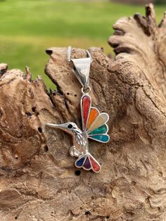 This beautiful Hummingbird pendant is made by hand by the beautiful Quechua people of the Peruvian Andes.  It is made by silver and natural semiprecious gemstones of the region. (lapis lazuli, chrysocolla, mother of pearl, spondyllus ) weight :4.1 gr width : 2.3 cm height with hook : 4 cm Hummingbird Pendant, Christmas Deals, Semi Precious Gemstones, Lapis Lazuli, Peru, Mother Of Pearl, Favorite Jewelry, Semi Precious, Jewelry Necklace Pendant