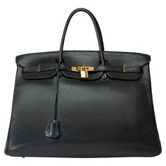 Beautiful​ ​Hermes​ ​Birkin​ ​40​ ​in​ ​Togo​ ​black​ ​leather,​ ​gold​ ​plated​ ​metal​ ​trim,​ ​double​ ​handle​ ​in​ ​black​ ​leather​ ​allowing​ ​a​ ​hand​ ​carry Flap​ ​closure Black​ ​leather​ ​inner​ ​lining,​ ​one​ ​zippered​ ​pocket,​ ​one​ ​patch​ ​pocket Signature:​ ​"Hermès​ ​Paris​ ​Made​ ​in​ ​France" Year:​ ​K​ ​square​ ​(2007) Dimensions:​ ​40x30x20​ ​cm​ ​(15,7x12,6x7,9​ ​Inches) Reference:​ ​101822 General​ ​condition:​ ​7/10 Sold​ ​with​ ​tirette,​ ​clochette,​ ​padlock​ ​and​ Gold Satchel With Metal Hardware For Business, Classic Gold Satchel With Metal Hardware, Gold Satchel With Gold-tone Hardware, Black Business Bag With Gold-tone Hardware, High-end Gold Satchel With Gold-tone Hardware, Black Rectangular Satchel With Lock, Luxury Black Satchel With Gold-tone Hardware, Gold Satchel With Branded Hardware For Business, Black Bags With Lock For Daily Use