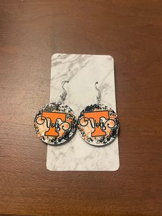 Tennessee Volunteers Earrings made with sublimation  Stainless Steel Posts  1.18" diameter Modge Podge, Tennessee Volunteers, Tennessee, Jewelry Earrings Dangle, Etsy Earrings, Dangle Drop Earrings, Dangle Earrings, Jewelry Earrings, Drop Earrings