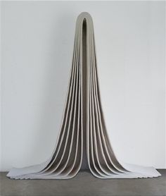 a sculpture made out of folded paper on top of a table