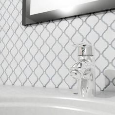 a bathroom sink that has a faucet and soap dispenser on it