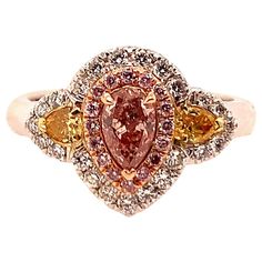 GIA Certified 0.38 Carat Natural Pink Diamond Cocktail Engagement Ring. The Ring is set with 23 natural colorless round diamonds, 16 natural round pink diamonds, and 2 natural intense orange-yellow pear shape diamonds, weighing 0.30 carats. Total weight of diamonds are 0.68 carats, total weight of ring is 7.83 grams (size 6.5). All diamonds are eye-clean, VS-I in clarity. 1940s Engagement Ring, Retro Engagement Rings, Diamond Sapphire Engagement Ring, Sapphire Diamond Engagement, Pink Diamond Ring, Contemporary Engagement Rings, Pink Diamonds, Platinum Diamond Engagement Rings, Modern Engagement Rings