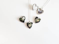 Capture memories with this exquisite real flower heart locket necklace, a perfect personalized gift keepsake. A beautiful way to cherish a special moment with a custom photo inside. Ideal for birthdays, anniversaries, or any meaningful occasion. Three design options available: Please see the photos for option 1, 2, and 3 and select the preferred one from the drop down menu.  Pendant is heart shaped that measures approximately .65" x .84" (17mm wide, 21.5mm long) The locket and chain are silver p Heart Locket Necklace, Capture Memories, Personalized Gifts For Her, Heart Locket, Flower Heart, Locket Necklace, Real Flowers, Custom Photo, Locket