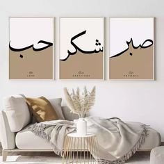 three framed art prints on the wall in a living room