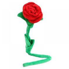 a red rose on a green headband with one end curled up to the side