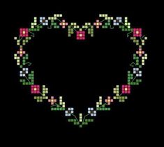 a heart made up of squares and flowers on a black background with the words love written in it