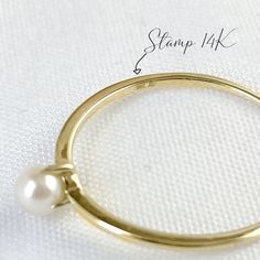 Elegant and timeless, mini Akoya pearl solitaire ring handcrafted in 10K solid yellow gold. Make it a treasure to yourself. Ships within 3 business days. - Stone info: 1pc of 3 to 3.5mm size mini genuine Akoya pearl - Band width: 1mm - The ring sits 4.45mm on the finger. - Made in 10 karat gold - Stamp with 10K. Stackable 14k Gold Pearl Ring With Round Band, Classic Stackable Pearl Ring, Classic Stackable Pearl Ring For Formal Occasions, Classic 14k Gold Stackable Pearl Ring, Classic 14k Gold Solitaire Pearl Ring, Classic 14k Gold Pearl Ring With Round Band, Minimalist 14k Gold Solitaire Pearl Ring, Classic Gold Pearl Ring, Stackable 14k Gold Pearl Ring Gift