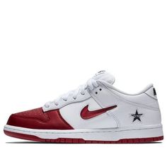 Nike and Supreme have partnered up once again, this time to release a special edition Nike SB Dunk Low skateboard shoe. This limited edition shoe is all white with a red synthetic toe box, and features jeweled Swooshes on the sides. The outsole has been updated with a semi-transparent rubber tread, and the shoe is finished off with embroidered co-branding throughout. (SNKR/Skate/Unisex/Low Top) Nike Skate Shoes With Boost Midsole For Skateboarding, Nike Skate Shoes With Boost Midsole, Custom Sneakers With Vulcanized Sole For Skateboarding, University Red Custom Sneakers For Streetwear, Red Nike Skate Shoes With Vulcanized Sole, Nike White Skate Shoes For Streetwear, Red Leather Basketball Shoes With Gum Sole, Urban Red Custom Sneakers With Red Sole, Urban Custom Red Sneakers With Red Sole