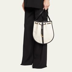 Saint Laurent "Daryl" shoulder bag in textile cotton and grained leather  Flat shoulder strap Drawstring closure  Approx. 11.4"H x 12.1"W x 0.8"D Made in Italy Leather Flats, Bergdorf Goodman, 4 H, Leather Shoulder Bag, Saint Laurent, Tops Designs, Shoulder Strap, In Italy, Shoulder Bag