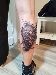 a person with a tattoo on their leg