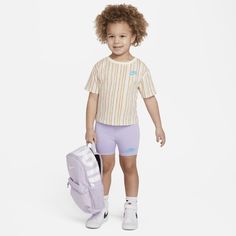 Keep your happy camper content and comfy in this cotton jersey 2-piece set. The tee has a tagless crewneck for easy wear and dropped shoulders for a relaxed fit. The matching bike shorts have added stretch for a comfy fit little ones can play comfortably in. Nike Short Sleeve T-shirt For Outdoor Activities, Nike T-shirt For Outdoor Activities, Casual Nike T-shirt For Outdoor Activities, Nike Casual T-shirt For Outdoor Activities, Nike Casual T-shirt For Outdoor, Outdoor Cotton T-shirt For Athleisure, Athleisure Outdoor Cotton T-shirt, Nike Athleisure Tops For Outdoor Activities, Nike Sportswear Tops For Outdoor Activities