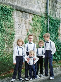 a group of young boys standing next to each other