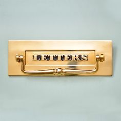 a brass door handle with the word embars on it's center piece