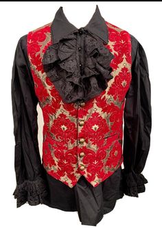 This is a stunning  black/red/ gold brocade waist coat with a vintage design  It is fully lined and well made. It has pockets  and adjustable back. It comes with a  black cotton pirate shirt with frill around the neck and cuffs.  Chest measurement is ML approx 42/44 Length front approx 24" Length back approx 23" Makes a stunning steampunk  outfit!  Thank you for looking Fitted Steampunk Vest For Costume Party, Vintage Fitted Vest For Costume Party, Fitted Vintage Vest For Costume Party, Fitted Winter Vest For Costume Party, Fitted Vest For Costume Party In Winter, Fitted Vest For Winter Costume Party, Fitted Vest For Larp And Halloween, Vintage Winter Costume Vest, Vintage Winter Vest For Costume