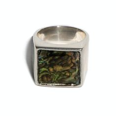 This is our 'Samuel' ring from our flat top Thomas collection. With its flat, square face adorned with a high polished 16mm Abalone, the 'Samuel' ring combines practicality and edge. This unisex signet ring is a go-to piece with endless wearability. Intimately connected to the sea, Abalone represents the tides of emotion and harmony in relationships. The play and variety of colors represent change as the beauty of existence. Abalone No two stones are alike Available in Sterling Silver & Yellow B Modern Signet Ring With Rectangular Stone And Polished Finish, Formal Square Rings With Polished Finish, Modern Square Cut Signet Ring With Polished Finish, Modern Square Rings For Formal Occasions, Modern Square Ring With Polished Finish, Modern Square Signet Ring With Polished Finish, Modernist Rectangular Signet Ring With Polished Finish, Rectangular Modernist Signet Ring With Polished Finish, Rectangular Sterling Silver Rings In Modernist Style