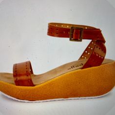 Nwot - Never Worn! Size 6 Details Fun Wedge Featuring Laser Cut Leather And Ankle Wrap With Buckle Closure. These Classic Cork Wedges Are Comfortable Enough For You To Frolic For Hours. - Open Toe - Leather Construction - Perforated Detail - Adjustable Ankle Buckle Strap Closure - Wedge Heel - Approx. 2.4" Heel - Made In Italy Casual Wedge Sandals With Heel Strap And Round Toe, Beach Wedge Sandals With Heel Strap And Round Toe, Summer Wedge Sandals With Cushioned Footbed And Round Toe, Leather Round Toe Wedge Sandals For Beach, Beach Leather Wedge Sandals, Leather Wedge Sandals For Beach, Beach Closed Toe Wedge Sandals With Heel Loop, Adjustable Ankle Strap Summer Wedge Sandals, Leather Wedge Sandals With Ankle Strap For Vacation