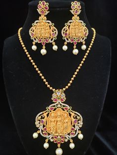 "Handmade Indian Jewelry item * Stunning Hand made Traditional jewelry set. * Pendant and Earrings are a set. * Packed in a box, Ideal For GiftingOn Request, We Can Add A Custom Message For Your Loved One (At No Additional Cost) :) * Gold Color is Matte gold tone, which has a copper hue as opposed to bright gold. * Chain Length: 18\"( Price not included in the pendent set.) Each chain has different price PLS. NOTE: Chains shown in the picture are for your reference only. They are not included in Temple Jewelry Sets With Matching Earrings For Festive Occasions, Temple Jewelry Earrings With Stones As Gift, Temple Jewelry Earrings With Stones For Gift, Festive Temple Jewelry Necklace With Stones, Festive Temple Necklace With Stones, Temple Jewelry Necklace With Matching Earrings As Gift, Temple Jewelry Pendant With Stones, Temple Jewelry Earrings With Stones For Celebration, Temple Jewelry Sets With Stones For Festive Occasions