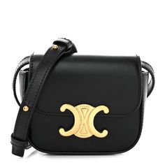 This is an authentic CELINE Shiny Calfskin Mini Triomphe in Black. This chic shoulder bag is crafted of calfskin leather in black. The bag features an adjustable leather shoulder strap, gold hardware, and a gold snap lock. This opens to a black leather interior with a patch pocket. Celine Purse, Celine Box, Black Mini Bag, Celine Shoulder Bag, Snap Lock, Bag Light, Celine Bag, Black Cross Body Bag, Flap Bag