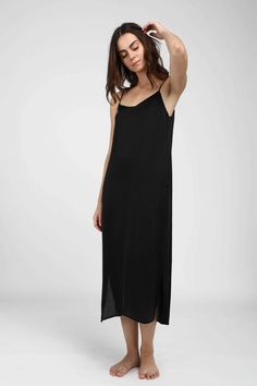 Simple meets elegant - it’s no wonder we named it the Easy Slip Dress. Designed with a relaxed fit, this silhouette has a scoop neck detail with hidden side pockets at hips. We love to wear ours layered underneath jackets and sweaters or wear just for lounging. French seam details mean that all raw edges are hidden in an elegant finished seam. Sleek Viscose Midi Dress For Summer, Sleek Midi Slip Dress For Summer, Sleek Midi-length Slip Dress For Summer, Sleek Summer Midi Slip Dress, Sleek Midi-length Summer Slip Dress, Sleek Summer Dress With Adjustable Straps, Sleek Summer Dresses With Adjustable Straps, Longline Midi Dress For Summer, Chic Viscose Slip Dress With Spaghetti Straps