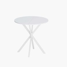 a white round table with two crossed legs