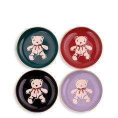 three plates with teddy bears on them in different colors and sizes, one has a red bow around its neck