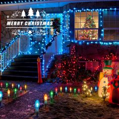 christmas lights are lit up in front of a house