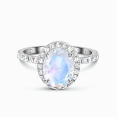 About This Ring
More glamour, more style, more you. Expand your style to the next level with our Moonstone Ring - Petite Lana. This gorgeous statement ring incorporates the magic of one genuine oval-shaped Moonstone that is enclosed in beautiful floral prongs and is surrounded by a glittering halo of White Topaz for a glam go-to look.Details
- Authentic Moon Magic Rainbow Moonstone- Stone Size: 0.39" x 0.30" (10mm x 8mm)- Cut: Oval-shaped brilliant cut- Gem authenticity approved b Magic Rainbow, Gem Diamonds, Rose Quartz Earrings, Rose Quartz Bracelet, Moonstone Stone, Rose Quartz Ring, Opal Bracelet, Moon Magic, Moonstone Necklace