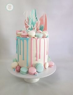 a cake decorated with pastel colors and icing