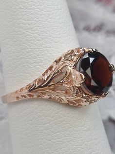 natural red garnet solitaire ring with swirl antique floral rose gold filigree Rose Gold Filigree Ring With Intricate Design, Rose Gold Filigree Ring Gift, Rose Gold Filigree Promise Ring, Elegant Bronze Ring For Formal Occasions, Classic Rose Gold Rings With Intricate Design, Classic Rose Gold Filigree Jewelry, Victorian Rose Gold Filigree Ring With Intricate Design, Classic Rose Gold Jewelry With Intricate Design, Vintage Rose Gold Solitaire Ring