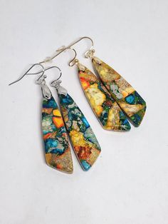 Colorful sea sediment jasper beads turned into custom earrings (choose silver or gold hardware at checkout). Gorgeous and dainty, these are sure to dress up any outfit! The metals are made of iron and nickel/lead free. Hypoallergenic. Artisan Multicolor Earrings With Natural Stones, Multicolor Artisan Earrings With Natural Stones, Unique Multicolor Jasper Jewelry, Handmade Multicolor Jasper Jewelry, Earrings Boho Chic, Boho Chic Earrings, Jasper Earrings, Chic Earrings, Copper Turquoise