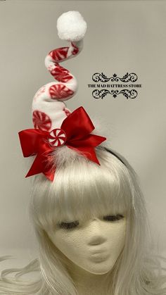 "You will be the life of the party with my new Peppermint Candy Swirly Hat! The hat is made of fun red and white Peppermint Candy fleece and is wired to adjust the \"squiggles\" as you choose. It is surrounded with white feathers, a Red bow accented with a felt \"peppermint\" and has a BIG white pom-pom on the top. The headband is removable allowing for personal preference in positioning on the head. Fascinators are typically worn off center on the right or left side of the head. Allows you to s Adjustable Christmas Costume Hats, Adjustable Christmas Holiday Headband, Adjustable Headband For Holiday Gifts, Whimsical Headband For Carnival, Whimsical Winter Mini Hats For Costumes, Adjustable Hair Accessories For Christmas Gifts, Whimsical Winter Costume Mini Hats, Adjustable Mini Hats For Winter Costume Party, White Mini Hats For Winter Party