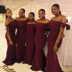 the bridesmaids are posing for a photo in their red gowns at the reception