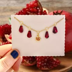 Persephone Necklace, Greek Mythology Jewellery, Pomegranate Charm Necklace, Pomegranate Jewellery,  Pomegranate Seed Charm The sheer beauty of this spectacular pomegranate necklace is so eye catching.  4 realistic juicy red pomegranate seeds made from resin with gold plated loops and a central gold pomegranate with red glass crystals hang from a hypoallergenic stainless steel gold plated chain. The pomegranate seeds are so ripe and juicy looking, you will not believe how real these look. A gorgeous necklace for Summertime and all year round. The pomegranate is an ancient fruit and has a special meaning in many cultures and religions. It symbolize love, life and strength. The special symbolism, combined with its attractive and interesting shape, makes pomegranate jewelry an interesting choi Pomegranate Jewellery, Persephone Jewelry, Gold Pomegranate, Persephone Necklace, Persephone Hades, Persephone Greek Goddess, Greek Necklace, Hades Persephone, Pomegranate Necklace