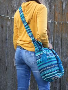 "Gorgeous Handmade Tassel Bag with Tassel Drawstring and Cross-body Strap. We design our Shoulder and Cross-body bags to be beautiful, ergonomic, functional, and durable. A resilient bag to carry your belongings to the gym, yoga studio, beach, camping, traveling, office, shopping, and all your daily activities. - 100% Handcrafted - Handmade products may vary slightly in design - Roomy Interior - Lightweight 1 lb. - Tribal Patterns - Durable Approx sizes: Bag: 7\" wide x 9\" height Length of stra Shoulder Yoga, Bag With Tassel, Ponte Vedra Beach, Boho Handmade, Blue Tassel, Beach Camping, Tassel Bag, Gym Yoga, Different Outfits