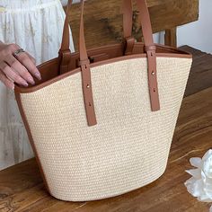 Add a summer-inspired touch to your accessories edit with this straw bucket tote bag. Woven from straw with leather trimmings, this handbag makes us look forward to summer and escapism. It comes with an open top and is roomy enough for all your essentials. Easy-to-wear wardrobe staples that combine classic and contemporary styles.Width (cm): 28 cmHeight (cm): 16 Color: Light brownInterior Material: Polyester CottonMaterial_bag: StrawBagType: Handbag & Shoulder bagBag Length: 28 cm Chic Summer Bags Made Of Natural Fiber, Spring Large Capacity Basket-shaped Bucket Bag, Chic Bucket-shape Shoulder Bag With Bamboo Handle, Chic Bucket Shoulder Bag With Bamboo Handle, Chic Shoulder Bag With Bamboo Handle In Bucket Shape, Chic Beige Straw Bag With Bamboo Handle, Chic Daily Use Straw Bag With Bamboo Handle, Chic Large Capacity Straw Bag For Spring, Straw Bucket Bag For Daily Use