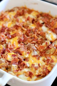 a casserole dish with bacon and cheese in it