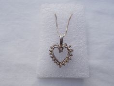 "OLD, VINTAGE STERLING SILVER CRYSTAL HEART PENDANT NECKLACE. THIS IS AN OLD PENDANT THAT I HAVE ADDED A NEW CHAIN TO. THIS PENDANT HAS BLING ! MEASURES OVER 7/8\" LONG. NICE WEIGHT. WEIGHS 5.6gm. SOLID STERLING MARKED 925. THE CHAIN IS 16\", MARKED 925 ITALY." Vintage Jewelry With Sparkling Stones For Gifts, Elegant 925 Stamped Jewelry For Anniversary, Costume Jewelry Pendant For Anniversary, Vintage Necklace With Diamond Accents As Gift, Vintage Necklace With Diamond Accents For Gift, Vintage Necklaces With Diamond Accents For Gift, Vintage White Gold Necklaces For Valentine's Day, Vintage Jewelry In Diamond White For Gift, Vintage Diamond White Jewelry Gift