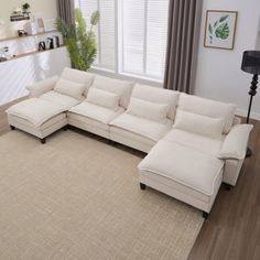 a living room with a large sectional couch