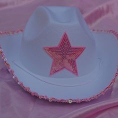 a white hat with a pink star on it