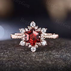 Hexagon Shape Garnet Engagement Ring,Rose Gold Snowflake Moissanite Ring,Art Deco Halo Stack Wedding Ring,January Birthstone Ring Gift Specifications: ►Sold As a Garnet Engagement Ring(This purchase includes 1 PC Ring.) Engagement Ring ►Material: Available in Silver & Solid 10K/ 14K/ 18k Rose/Yellow,/White,Gold ►Center stone:Hexagon Cut [6mm] Natural Garnet. 1.01 Carat.(Approx.) ►For Solid Gold Ring:Accented with Natural SI/H Natural Diamond & Moissanite(E-F color, VVS clarity. ) ►For Silver Rin Burgundy Engagement Ring, Diamond And Garnet Ring, Octagon-shaped Halo Jewelry For Anniversary, Octagon Halo Rings For Anniversary, Asscher Cut Diamond Wedding Ring, Red Asscher Cut Rings For Wedding, Red Asscher Cut Wedding Rings, Wedding Ring With Octagon Halo Design, Hexagon Diamond Ring For Wedding