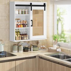 a kitchen with a sink, window and spice rack on the wall next to it