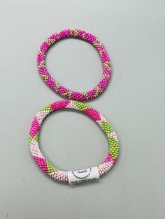 2 Aid Through Trade Roll-On® Bracelet Pink and Green Glass Beads 7.25" Pink Bracelet, Roll On, Bracelets And Charms, Green Glass, Fashion Watches, Pink And Green, Glass Beads, Jewelry Watches, Jewelry Bracelets