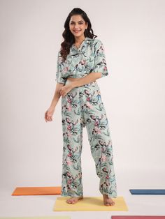 Indulge in ultimate comfort and style with our Cozy Cotton Women's Night Suit. This thoughtfully designed sleepwear set combines elegance and relaxation, making it the perfect addition to your nighttime routine. Features: Soft & Breathable Fabric: Made from 100% high-quality cotton, ensuring a comfortable and breathable experience throughout the night. Stylish Design: Featuring a chic and modern design that keeps you looking stylish even in your sleep. Relaxed Fit: The night suit offers a relaxed and comfortable fit, allowing you to move freely and sleep soundly. Easy Care: Machine washable for your convenience, maintaining its softness and quality wash after wash. Perfect for All Seasons: Lightweight and versatile, ideal for use all year round. Ideal For: Lounging at home Cozy nights in G Casual Floral Print Sets For Sleepover, Casual Floral Print Sleepover Sets, Printed Sets With Relaxed Fit For Lounging, Green Relaxed Fit Loungewear Sets, Green Relaxed Fit Lounging Sets, Casual Floral Print Sets With Long Pants, Casual Green Pajama Party Sets, Casual Green Sets For Pajama Party, Green Short Sleeve Loungewear Set