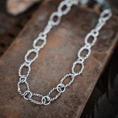 Handforged into twisted links of sterling silver, this chunky chain necklace is acowgirl's dream. So saddle up and rock it for a wild western look! Yeehaw! 18-19" adjustable Chunky chain necklace Mariner Chain links Hand forged Made by hand and heart Silver Metal Western Necklace, Artisan Silver Necklaces For Western-themed Events, Artisan Silver Necklace For Western-themed Events, Turquoise Jewelry Western, Chain Silver Necklace, Chunky Chain Necklace, Cowgirl Jewelry, Chunky Chain Necklaces, Western Look