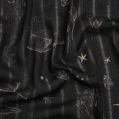 the fabric is black and white with stars on it