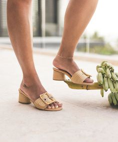 Understated, yet elevated. We've taken our most minimal heel silhouette and dressed it up with an oversized buckle for the perfect retro-chic touch. Be sure to add these to your beach bag before your next vacay. Raffia Upper Synthetic Outsole Synthetic Lining + Sock 2" Heel Height Imported Chic Heels With Rectangular Buckle Closure, Chic Block Heels With Rectangular Buckle Closure, Summer Ankle Strap Block Heels For Work, Summer Workwear Ankle Strap Block Heels, Summer Workwear Block Heels With Ankle Strap, Casual Heels With Buckle Closure And Square Toe, Casual Square Toe Heels With Buckle Closure, Spring Heels With Rectangular Buckle Closure, Trendy Heels With Buckle Closure For Day Out