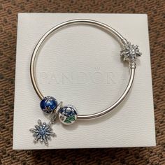 Authentic Pandora Fireworks Bangle Bracelet With 3 Charms Christmas X’mas Themed Limited Edition Bangle Bracelets 925 Sterling Silver. Engraving On Outside Of Bracelet Say "The Best Is Yet To Come" Bracelet Is Brand New, Never Worn. Charms Are In Excellent Like New Condition. (Two Charms Are New Besides Snowflakes Dangle Charm Is In Excellent Condition.) Everything Is Authentic Pandora. Sterling Silver 925 Everything Is Stamped 925 Ale Very Beautiful Set. Come With Original Pandora Box. Perfect Silver Holiday Bracelet, Christmas Festive Silver Charm Bracelet, Silver Bracelet For Holiday, Silver Bracelets For Holiday, New Year Holiday Jewelry, Silver Charm Bracelets For Christmas, Silver Christmas Festive Bracelets, Silver Bracelets For Christmas Festive Season, Festive Silver Bracelets For Christmas