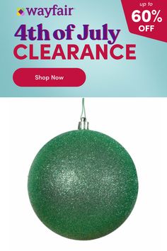 a green ornament hanging from a string with the text, wayfair 4th of july clearance