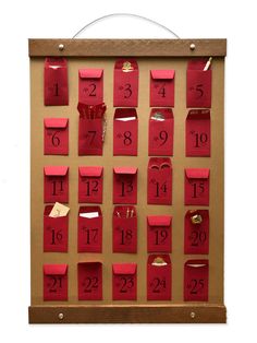 a bulletin board with red paper and numbers on it