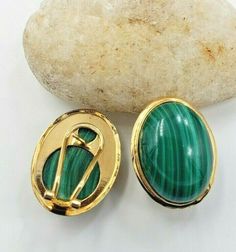 Title Green Oval Cabochon Malachite Earrings in 14KT Yellow Gold Omega Clip Designer Unbranded Material 14Kt Yellow Gold    585Stamped   Style Vintage Gemstone Details   All measurements are approximate and may vary slightly from the listed dimensions.  2 Oval Malachite stones L 18.04mm x W 12.33mm D 5.37mm Estimated Measurements  Length/Width/Depth 20.88mm x 15.97mm x 6.22 Estimated  Total Weight of the Item DWT: 5.2   Grams: 8.1 Condition Pre-owned- In good Condition – Light scratches Dealer n Malachite Earrings, Green Oval, Malachite Stone, Detailed Pictures, Fine Jewellery Earrings, Oval Cabochon, Style Vintage, Jewelry Watches, Fine Jewelry